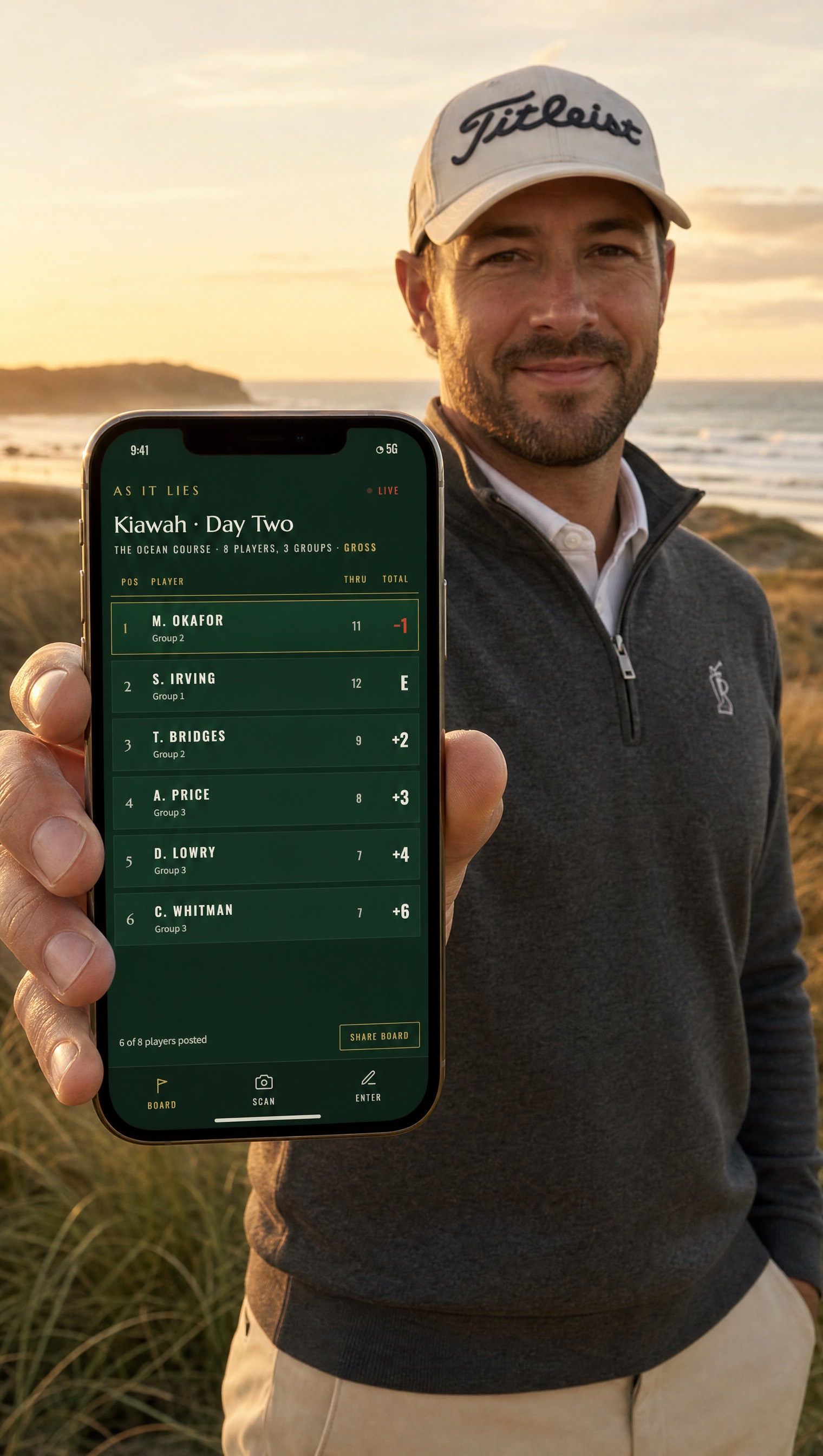 A golfer at dusk holding a phone showing the live AS IT LIES leaderboard